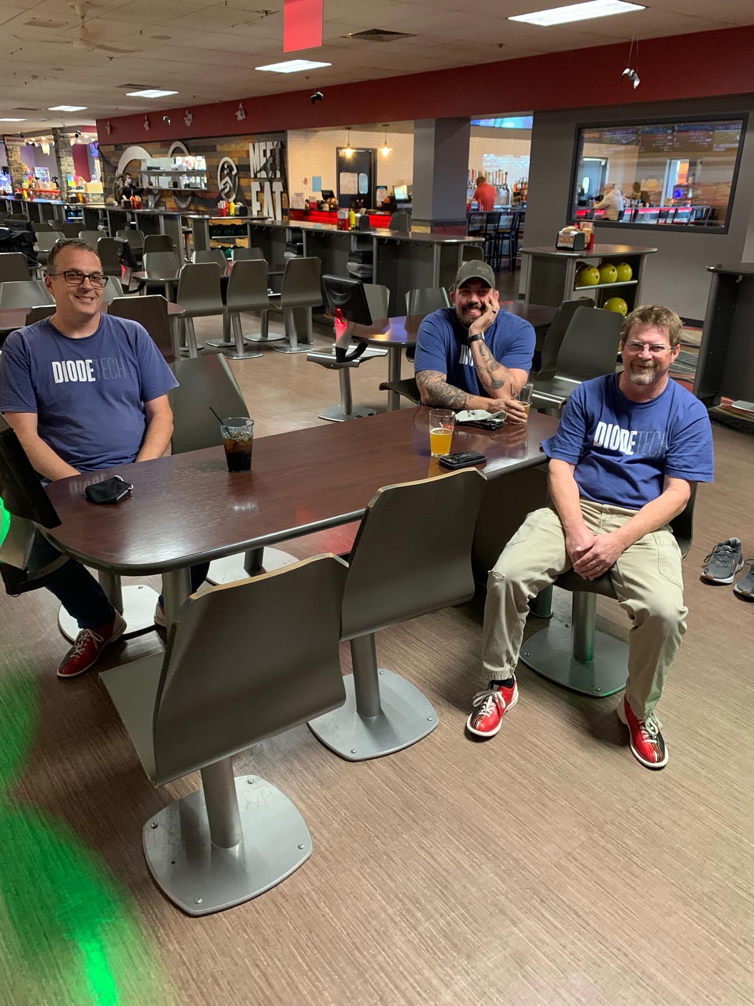 Men in bowling facility