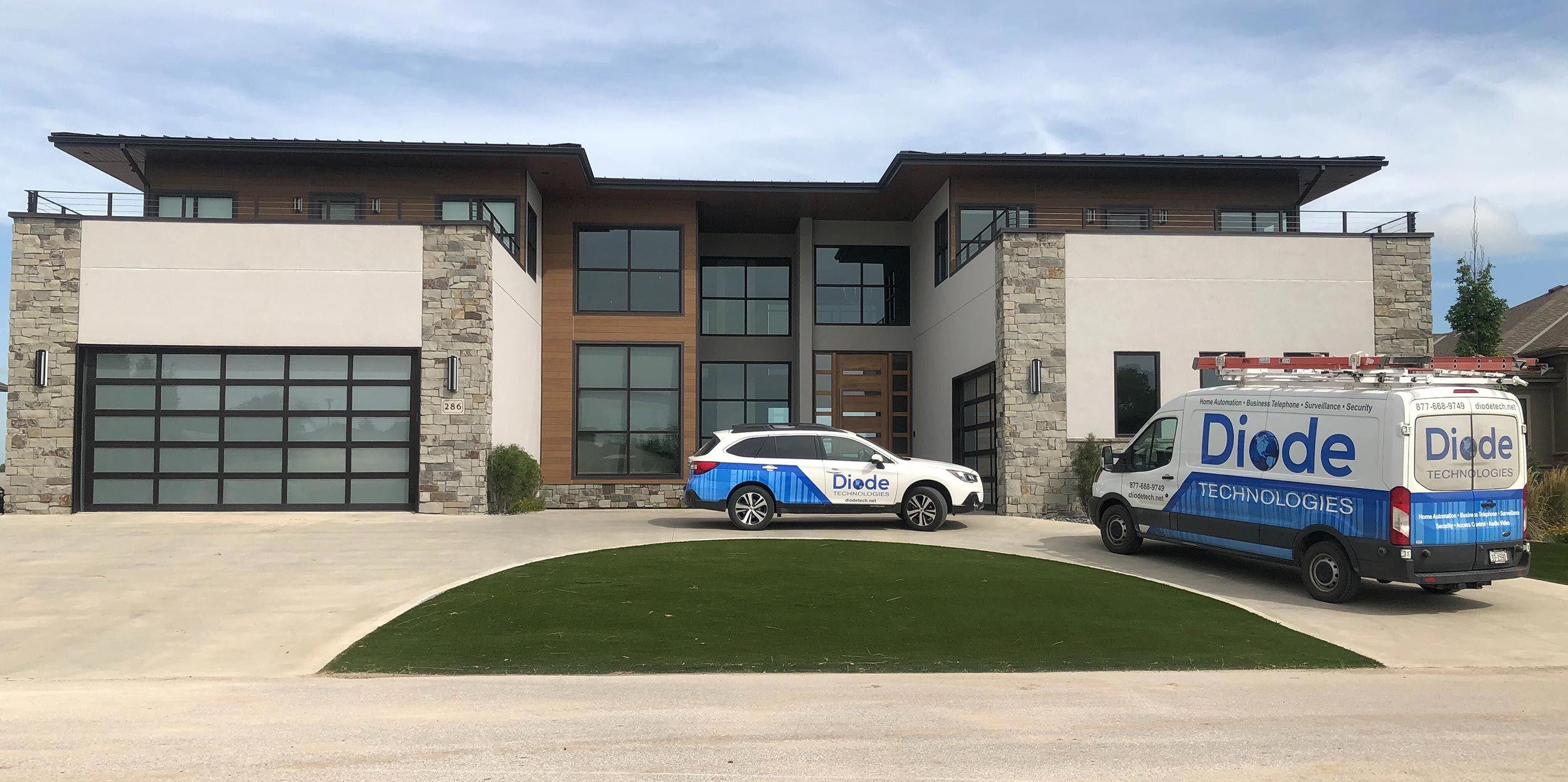 Company Vehicle fleet in front of a modern house