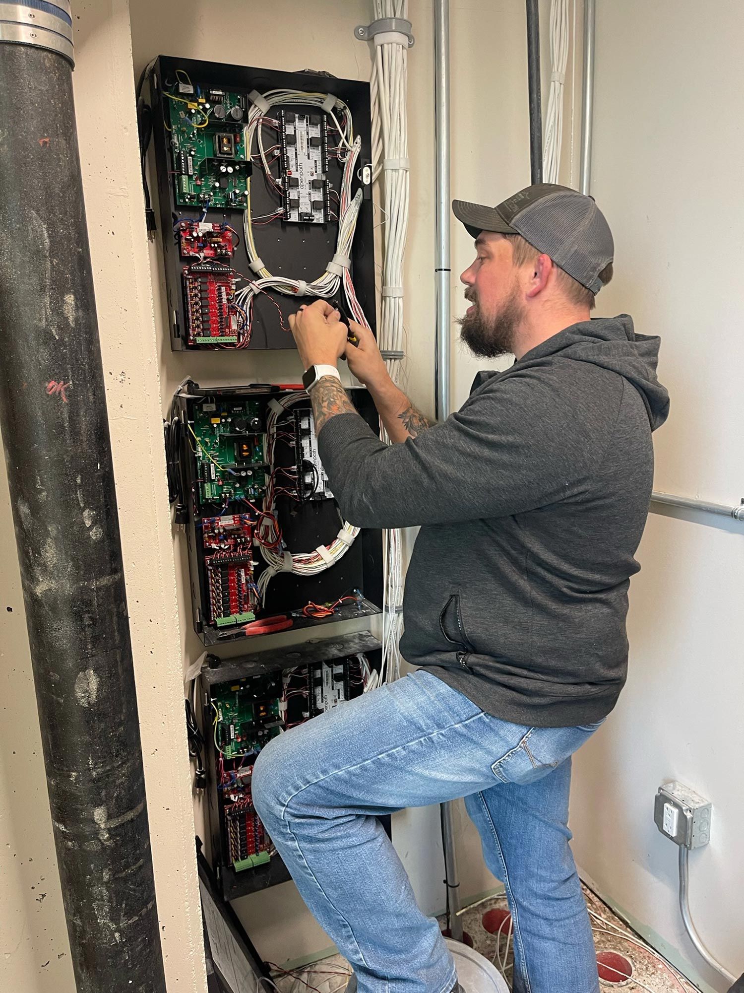 Man working on electrical board