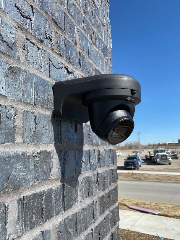 Surveillance Camera in a grey stone wall